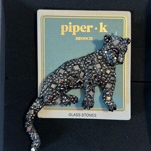 Huge glass leopard broach.